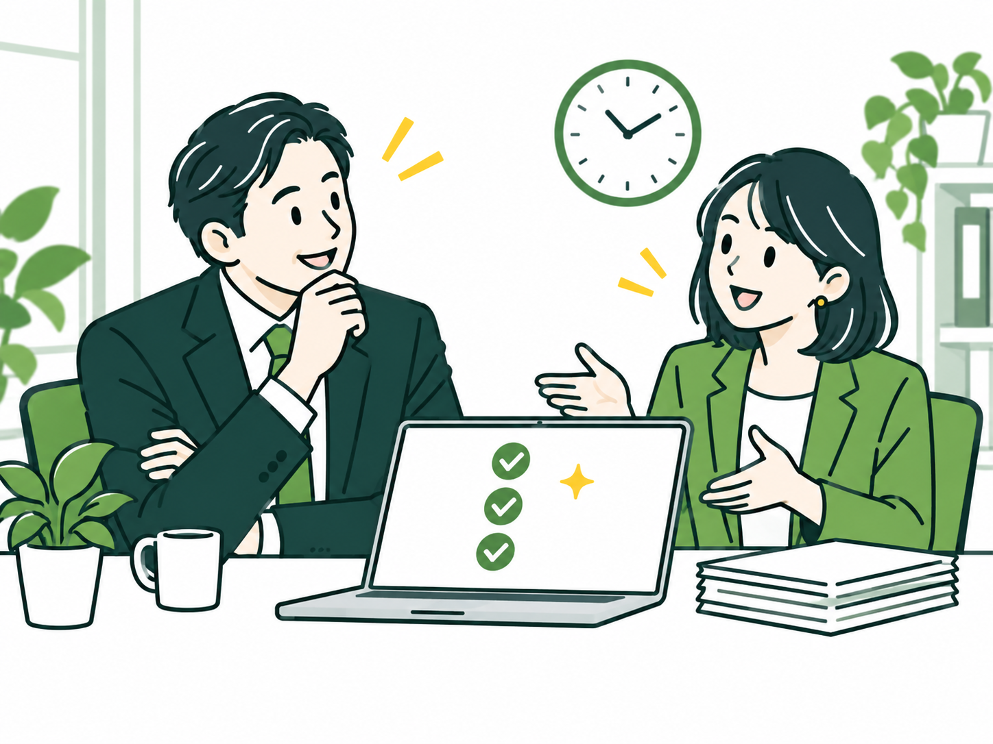 パソコンで業務を整理し、対話する時間を持つ二人